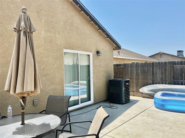 view of patio with central AC unit