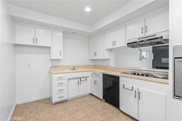 kitchen with sink, black appliances, white cabinets, and light tile patterned floors