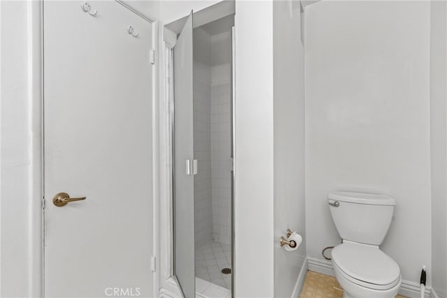 bathroom with toilet and walk in shower