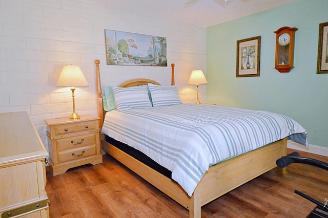 bedroom featuring ceiling fan and light wood-type flooring