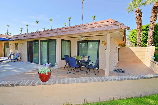 back of house featuring ceiling fan and a patio area