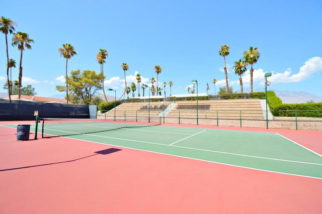 view of sport court featuring basketball hoop