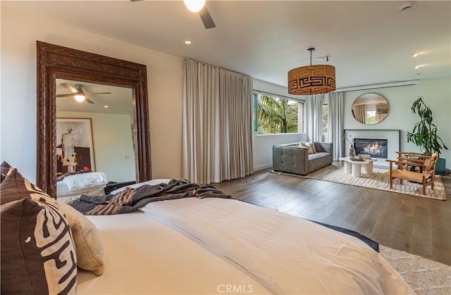 bedroom featuring ceiling fan and hardwood / wood-style floors