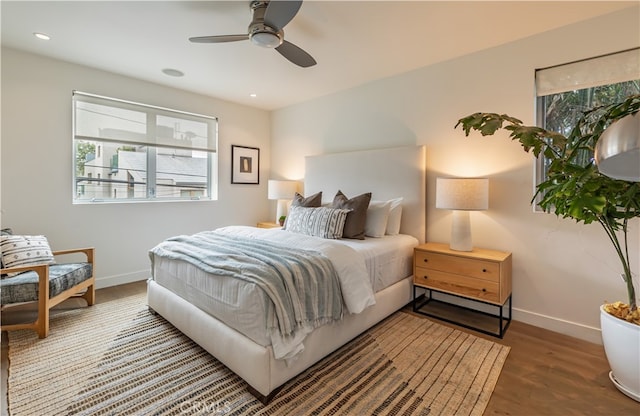 bedroom featuring ceiling fan and hardwood / wood-style flooring