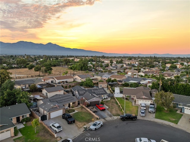 aerial view at dusk with a mountain view