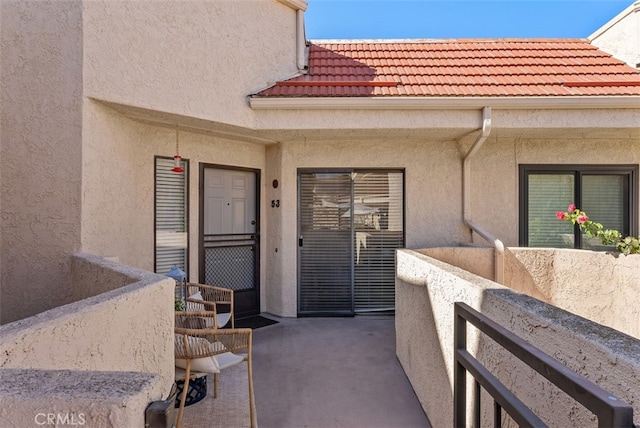 entrance to property with a patio area