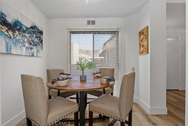 dining area featuring hardwood / wood-style flooring