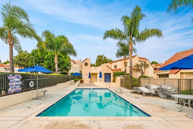 view of swimming pool featuring a patio area