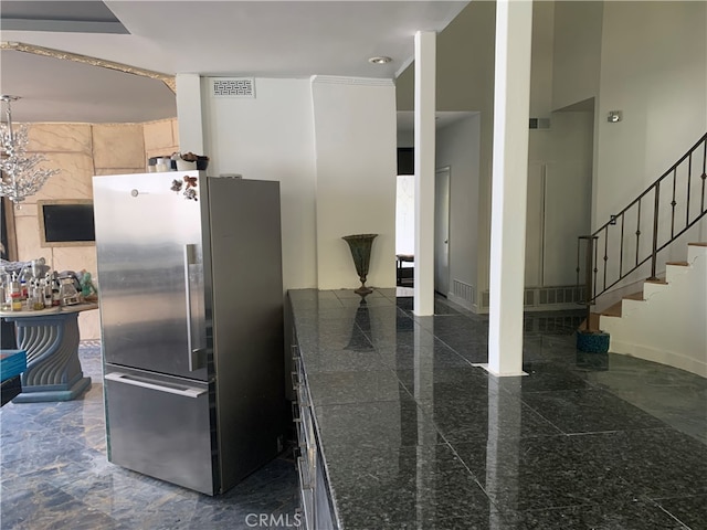 kitchen featuring stainless steel refrigerator