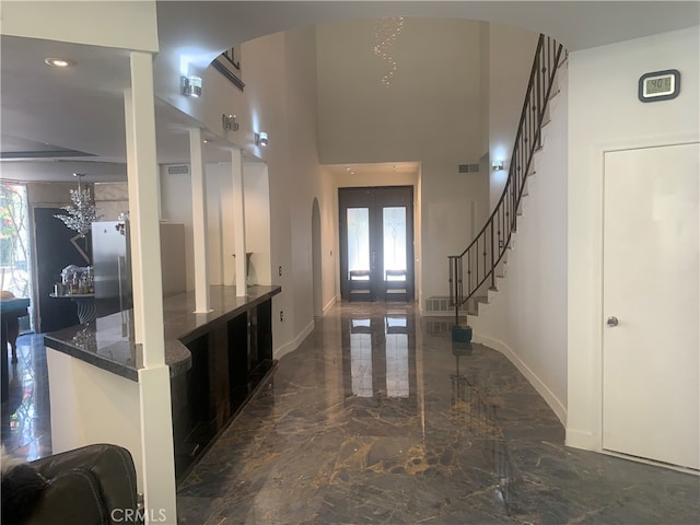 interior space featuring french doors and a healthy amount of sunlight