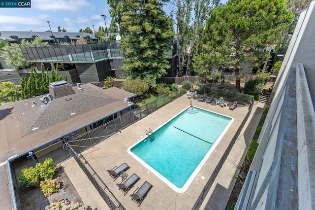 view of swimming pool featuring a patio