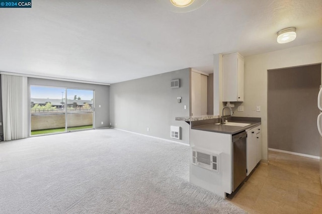 kitchen featuring sink, light carpet, stainless steel dishwasher, kitchen peninsula, and white cabinets