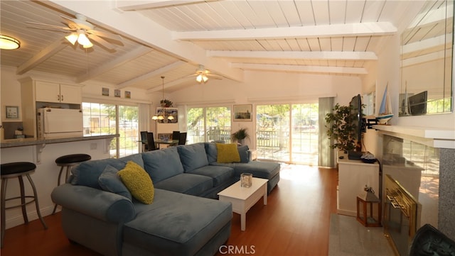 living room with ceiling fan, lofted ceiling with beams, and dark hardwood / wood-style flooring