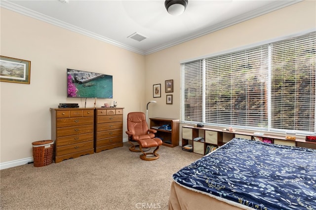 bedroom featuring ceiling fan, ornamental molding, and carpet