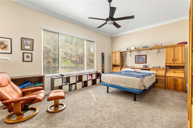 carpeted bedroom featuring ornamental molding and ceiling fan