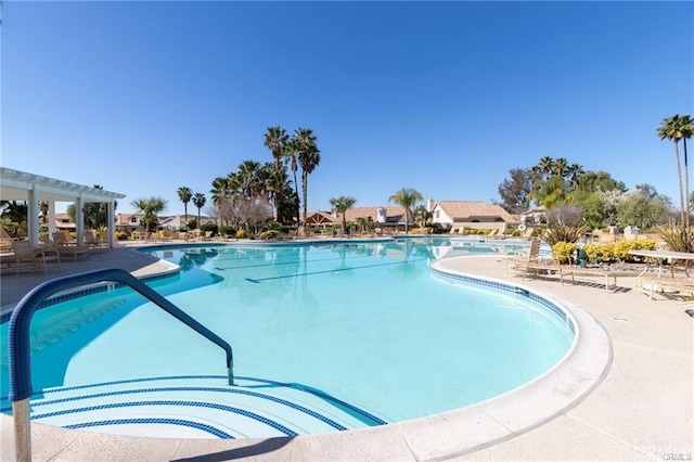 view of pool with a pergola and a patio