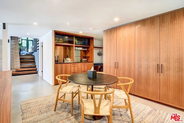 dining room featuring sink