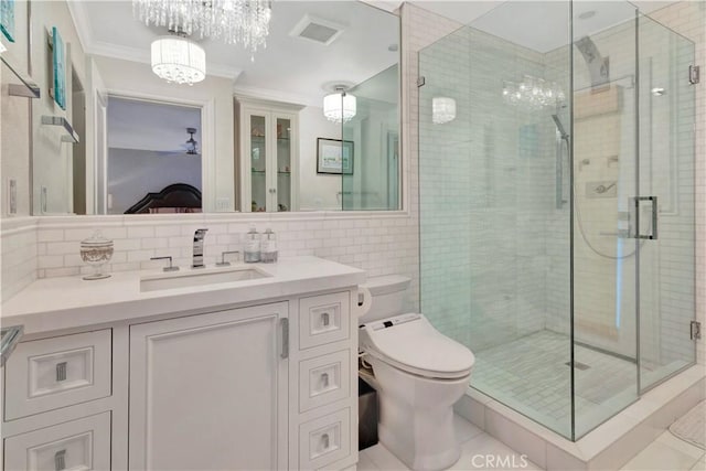 bathroom featuring tile patterned floors, walk in shower, ornamental molding, tile walls, and toilet