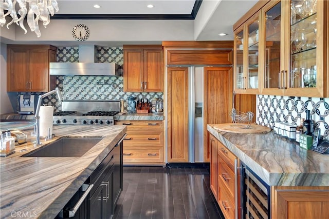 kitchen with wall chimney exhaust hood, paneled fridge, tasteful backsplash, wine cooler, and dark hardwood / wood-style flooring