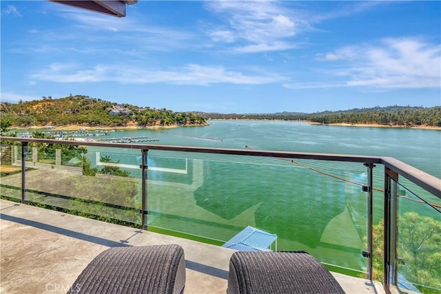 balcony featuring a water view