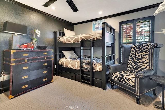 bedroom with carpet flooring, ceiling fan, and ornamental molding