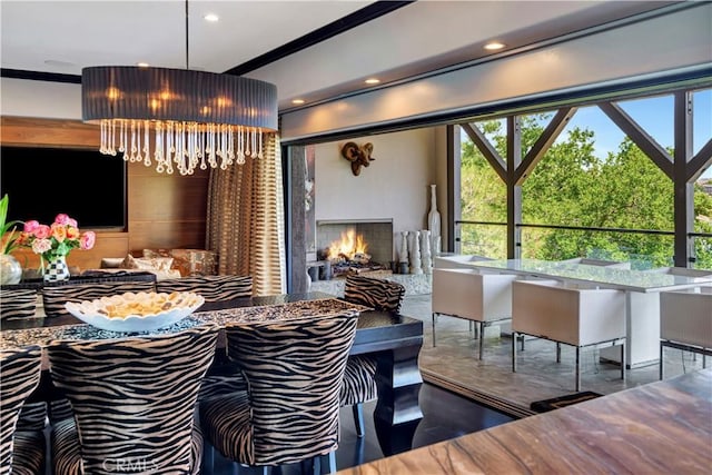 dining area featuring crown molding and an inviting chandelier