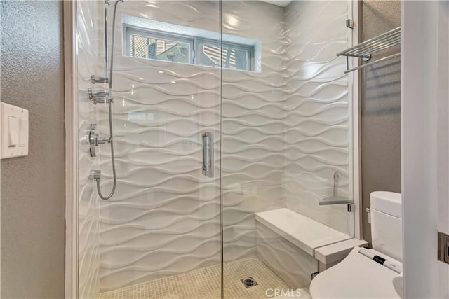 bathroom featuring a shower with door