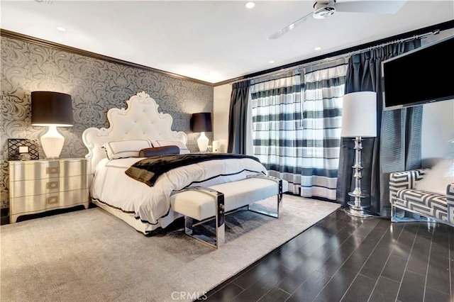 bedroom featuring crown molding, hardwood / wood-style floors, and ceiling fan