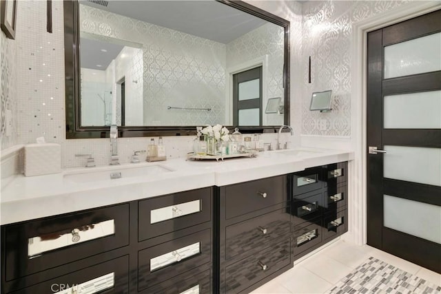 bathroom featuring tile patterned flooring and vanity