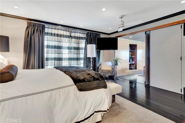 bedroom with crown molding, ceiling fan, and hardwood / wood-style flooring