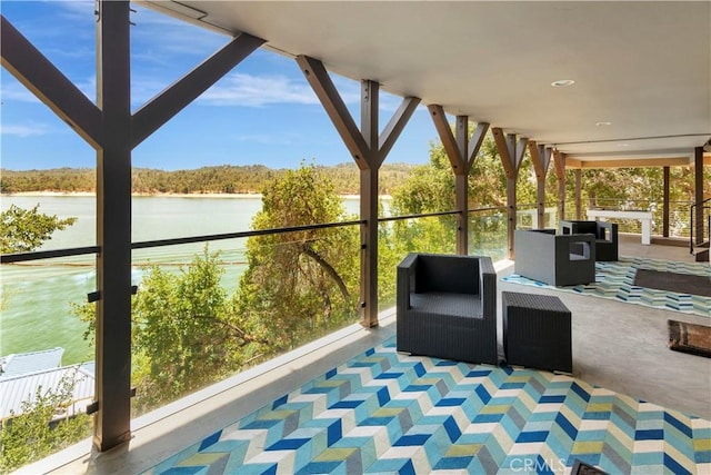 view of patio with a water view