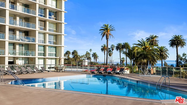 view of swimming pool with a patio area