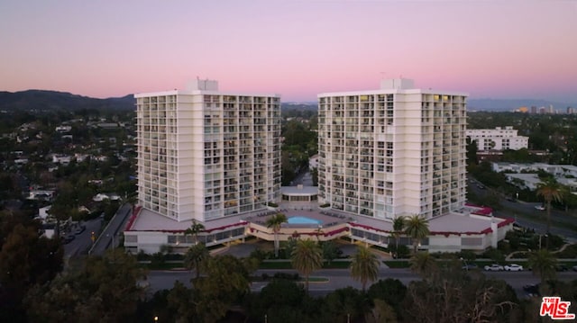 view of outdoor building at dusk