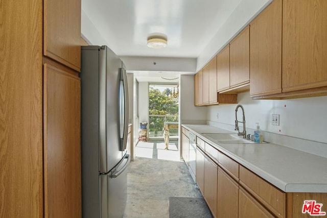 kitchen featuring stainless steel fridge and sink