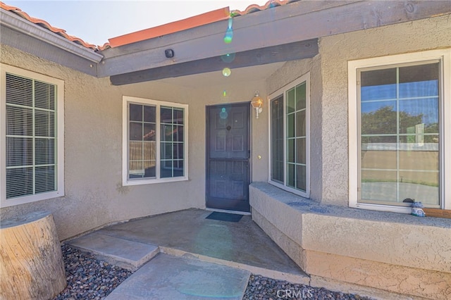 property entrance with a patio area