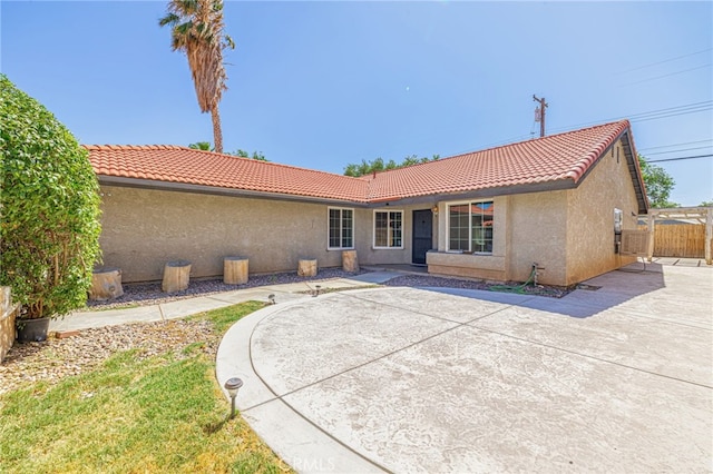 rear view of house featuring a patio