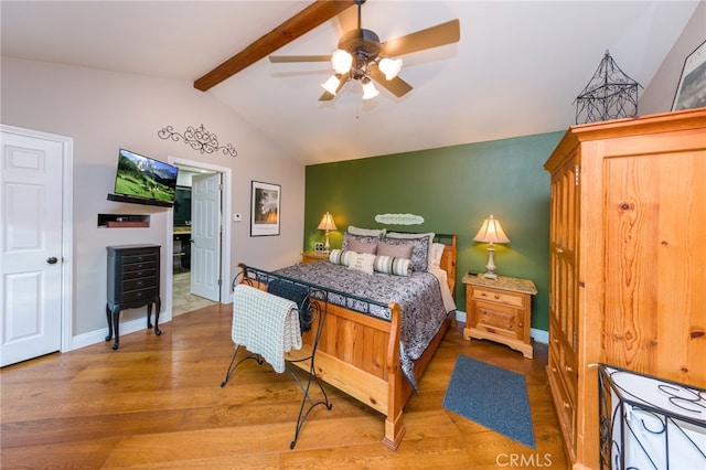 bedroom with wood-type flooring, vaulted ceiling with beams, and ceiling fan