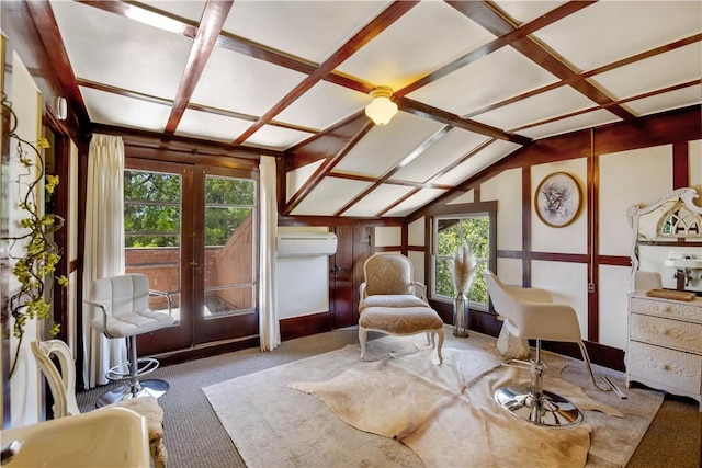 interior space featuring carpet flooring, lofted ceiling, an AC wall unit, and french doors