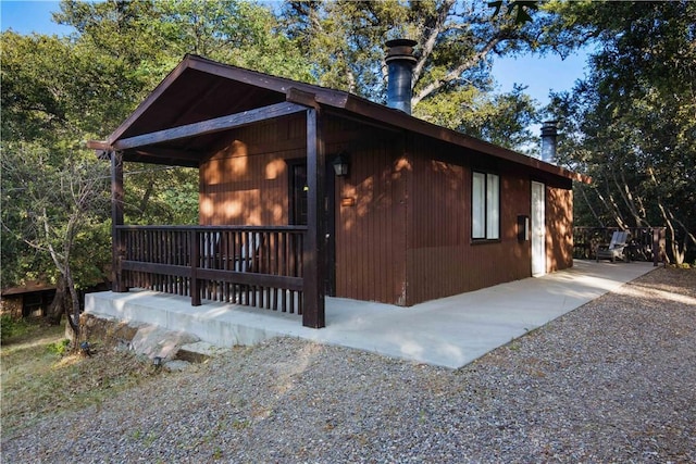 view of side of property with a porch