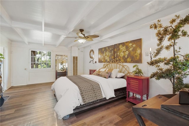 bedroom featuring beam ceiling, ceiling fan, and wood-type flooring