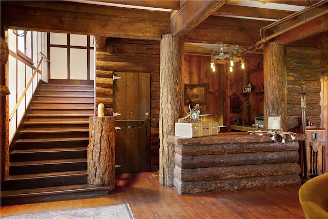 interior space featuring beamed ceiling and wood-type flooring