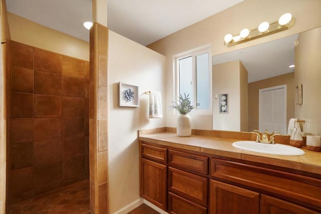 bathroom featuring vanity and a shower