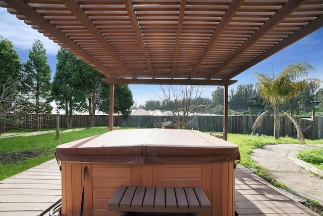 wooden deck with a pergola and a hot tub