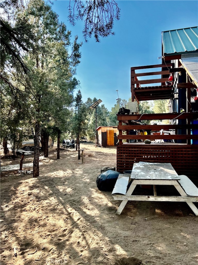 view of community with a storage shed and a playground