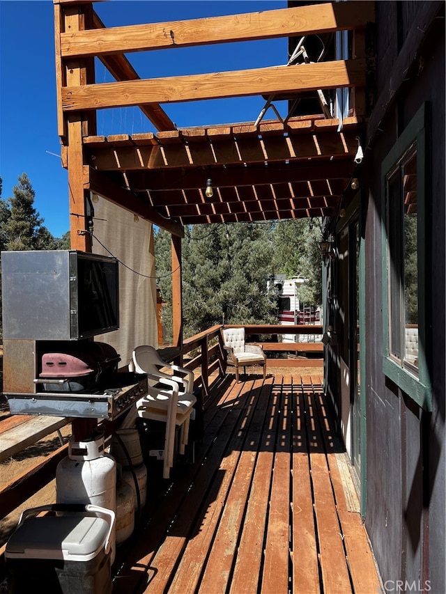 wooden terrace featuring a pergola