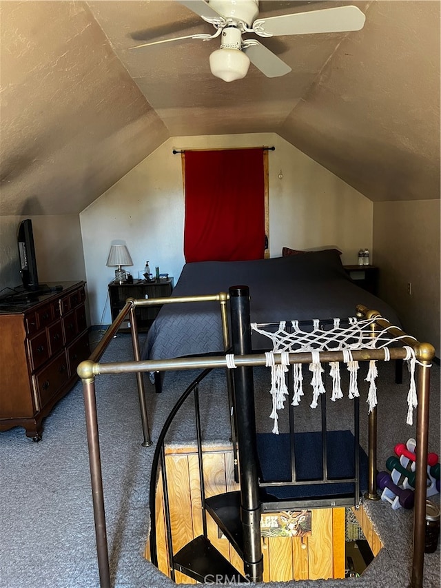 carpeted bedroom featuring lofted ceiling and ceiling fan