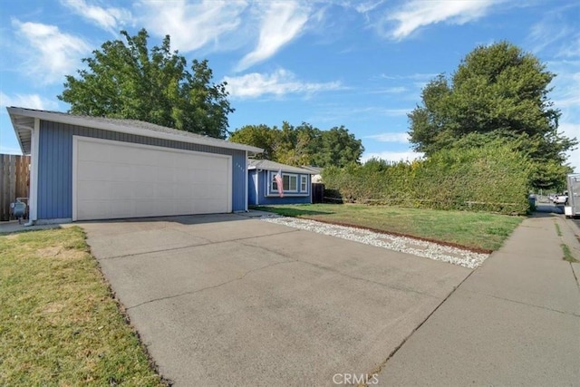 ranch-style house with a front lawn and a garage