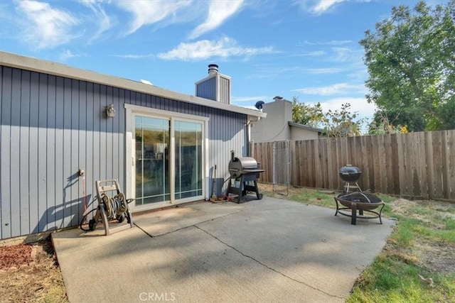 view of patio featuring a grill and a fire pit