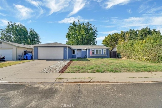 ranch-style house with a garage and a front yard