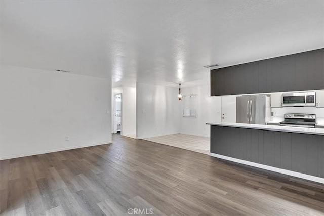 unfurnished living room with light wood-type flooring